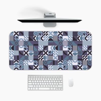 Infidu desk pad with bold geometric shapes in cool tones of blue, black, white, and purple.