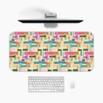 Colorful abstract block pattern desk pad in pastel and bright tones with a playful vintage art design.