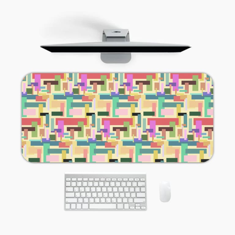 Colorful abstract block pattern desk pad in pastel and bright tones with a playful vintage art design.