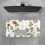 Minimalist desk pad featuring white background with golden abstract doodles and shapes in a vintage art style.