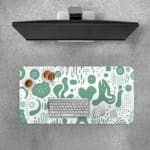 Infidu desk pad with green abstract shapes on white background, inspired by vintage art.