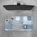 Infidu abstract mosaic desk pad with blue and grey artistic patchwork designs.