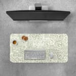 Infidu desk pad with light green abstract doodle design on cream background, featuring playful shapes, lines, and artistic elements.
