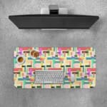 Colorful abstract block pattern desk pad in pastel and bright tones with a playful vintage art design.