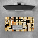 Infidu desk pad with earth-tone geometric blocks and layered abstract design on a white background