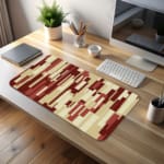 Infidu bold pixel block desk pad with warm red tones and abstract geometric pattern.