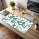 Infidu desk pad with green abstract shapes on white background, inspired by vintage art.