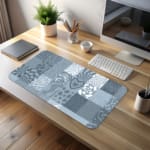 Infidu abstract mosaic desk pad with blue and grey artistic patchwork designs.