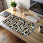 Infidu desk pad with geometric pattern in beige, navy, and gray on a white background
