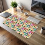 Colorful abstract block pattern desk pad in pastel and bright tones with a playful vintage art design.