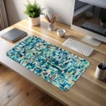 Infidu modern geometric desk pad with cool shades of blue, teal, and beige in a mosaic pattern on a white background.