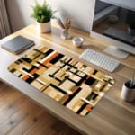 Infidu desk pad with earth-tone geometric blocks and layered abstract design on a white background