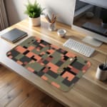 Infidu pixel camouflage desk pad in earthy green, orange, and brown tones