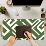 Infidu desk pad with bold white maze pattern on deep green background, inspired by vintage art and wall décor.