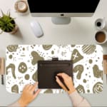 Minimalist desk pad featuring white background with golden abstract doodles and shapes in a vintage art style.