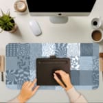 Infidu abstract mosaic desk pad with blue and grey artistic patchwork designs.