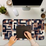 Infidu desk pad with navy and neutral geometric block pattern on white background.