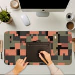 Infidu pixel camouflage desk pad in earthy green, orange, and brown tones