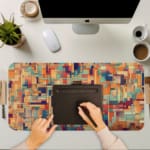 Infidu mosaic geometric desk pad in warm artistic tones with a colorful rectangular pattern