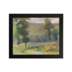Vintage countryside wall art with yellow flower fields, tall green trees, and a soft cloudy sky in natural tones. hung on the wall