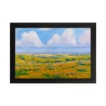 Infidu vintage wall art featuring a serene pastoral landscape with rolling hills, open fields, and soft clouds in the sky. hung on the wall on a white background