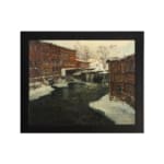 Vintage winter river scene with brick buildings and snowy rooftops by Infidu. hung on the wall