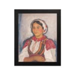 Vintage wall art of Eastern European woman in traditional red and white clothing with embroidered details. hung on the wall