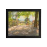 Vintage wall art of a sunny terrace with trees, wooden floor, and distant hills, capturing a peaceful outdoor scene. hung on the wall