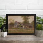 Vintage countryside wall art with rustic houses, tall trees, and soft earthy tones under a cloudy sky. displayed on the wall
