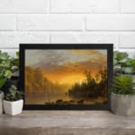 Infidu vintage sunset wall art showcasing calm water, tall trees, and a glowing sky in warm tones of orange, yellow, and brown. displayed on the wall