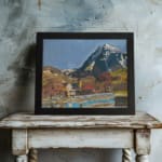 Vintage village at the base of snowy peaks with colorful houses, hills, and a serene river or pond. displayed on the wall