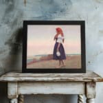 Vintage wall art of a woman on a grassy cliff overlooking the sea, wearing a red headscarf and holding a jug, in soft earthy tones. displayed on the wall