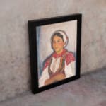 Vintage wall art of Eastern European woman in traditional red and white clothing with embroidered details. displayed on the wall