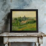 Infidu Vintage Countryside Landscape Wall Art featuring a charming village scene with green fields, trees, and a warm yellow sky. displayed on the wall