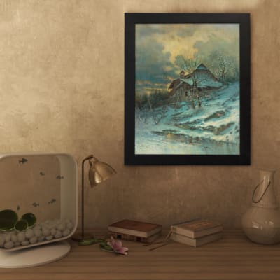 Vintage wall art of a snowy cottage on a hillside with bare trees, frozen stream, and soft blue tones in a peaceful winter scene. displayed on the wall