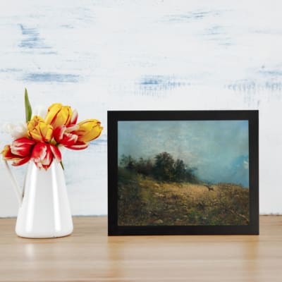 Serene vintage art of a deer in a peaceful nature landscape with soft browns, greens, and a misty atmosphere. displayed on the wall