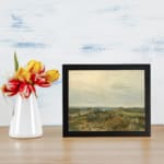 Infidu vintage wall art featuring peaceful countryside river, fields, and trees in soft green, brown, and beige tones. displayed on the wall