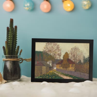 Vintage countryside autumn scene wall art with houses, colorful trees, and soft natural colors in a serene, peaceful setting. displayed on the wall