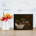 Infidu Vintage Still Life with Fruits and Animals Wall Art, showcasing a table with fruits, birds, and a rabbit, framed in dark tones. displayed on the wall