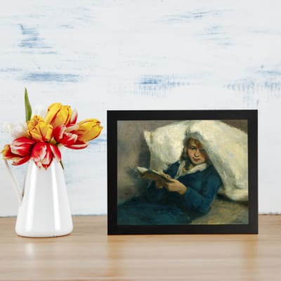 Infidu Vintage Wall Art of a girl peacefully reading with soft blue, white, and beige tones in a cozy, relaxed setting. displayed on the wall