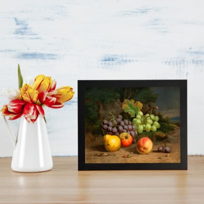 Vintage fruit still life wall art with grapes, apples, peaches, and plums on a rustic surface and dark leafy background. displayed on the wall