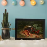 Vintage still life of cherries spilling from a basket, featuring vibrant red, orange, and yellow fruit with deep green leaves. displayed on the wall