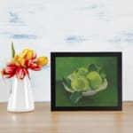 Infidu Vintage Green Apples in White Bowl Still Life Wall Art showcasing green apples in a white bowl with a soft green background. displayed on the wall
