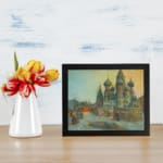 Vintage snowy cityscape with Russian domes, soft blue and yellow tones, cozy winter scene by Infidu. displayed on the wall