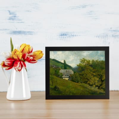 Vintage countryside wall art with green hills, trees, and a gray-roofed house in a calm rural setting. displayed on the wall