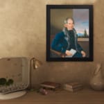 Vintage portrait wall art of an older man in a fur-trimmed coat holding a paper, with a window view and soft sky in the background. displayed on the wall