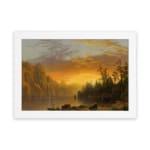 Infidu vintage sunset wall art showcasing calm water, tall trees, and a glowing sky in warm tones of orange, yellow, and brown. hung on the wall