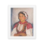Vintage wall art of Eastern European woman in traditional red and white clothing with embroidered details. hung on the wall