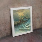 Vintage wall art of a snowy cottage on a hillside with bare trees, frozen stream, and soft blue tones in a peaceful winter scene. displayed on the wall