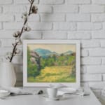 Vintage wall art featuring peaceful green fields, yellow flowers, and blue hills, creating a calming nature scene. displayed on the wall